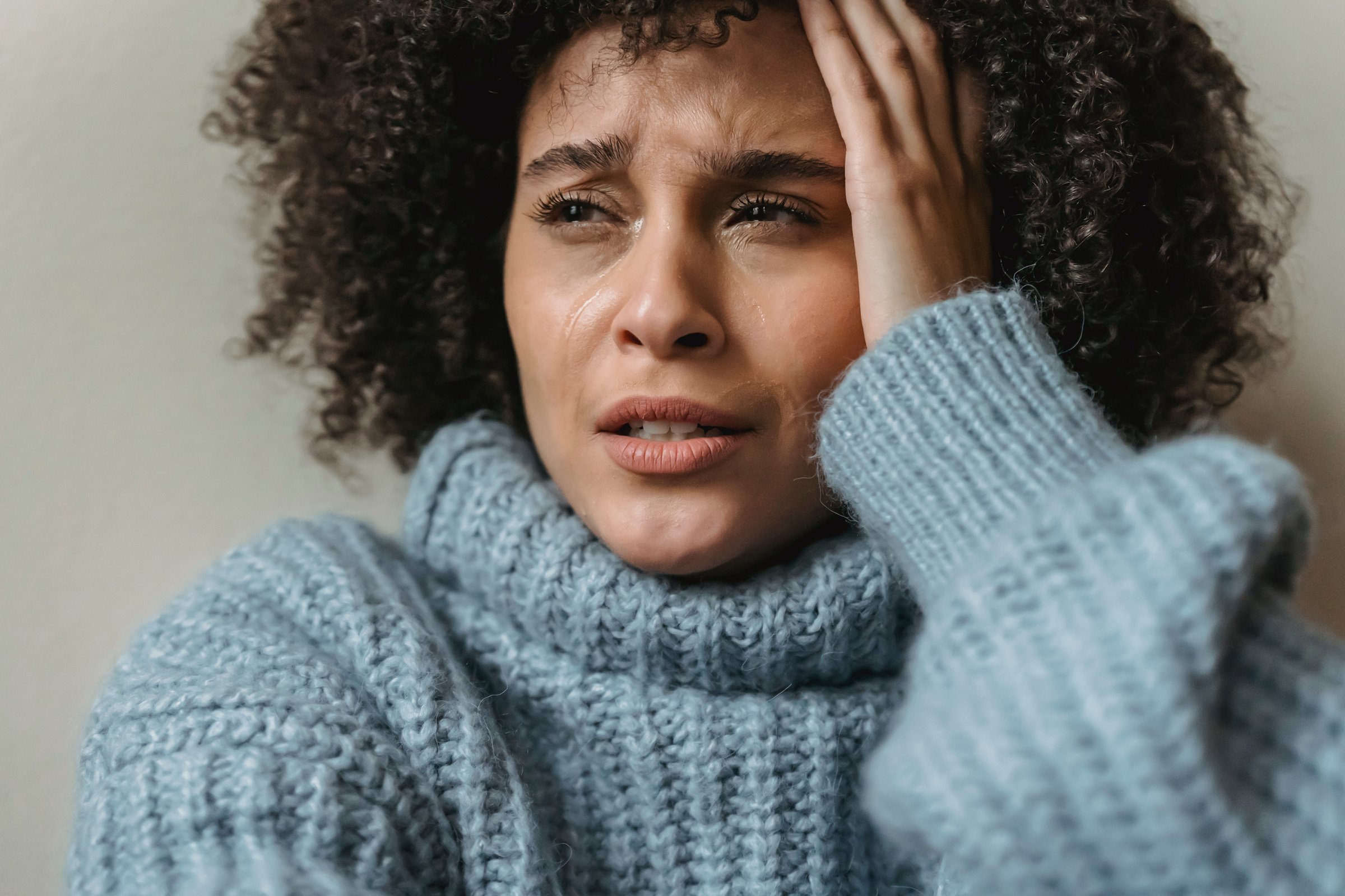 Sad black female crying and looking away